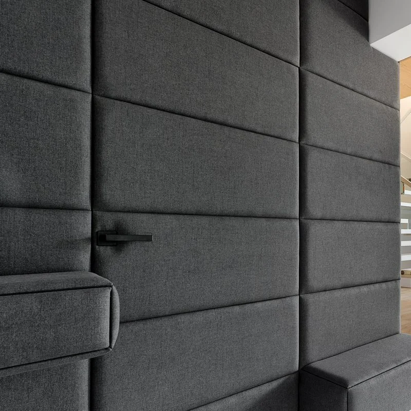 Concealed door finished in textile upholstery